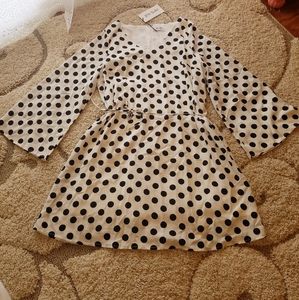 Black and white polka dot dress with bell sleeves